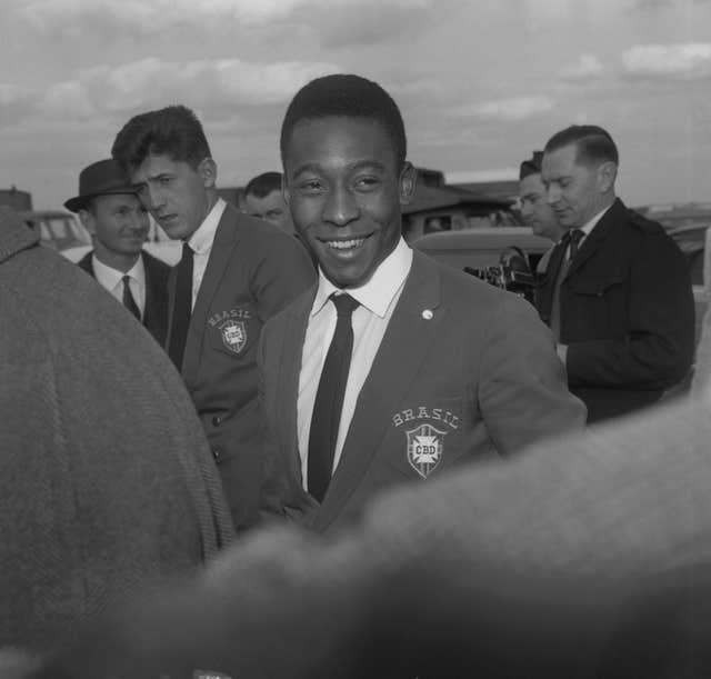 Pele on his arrival at London Airport from West Germany. He travelled with the Brazilian team for a friendly match against England at Wembley Stadium