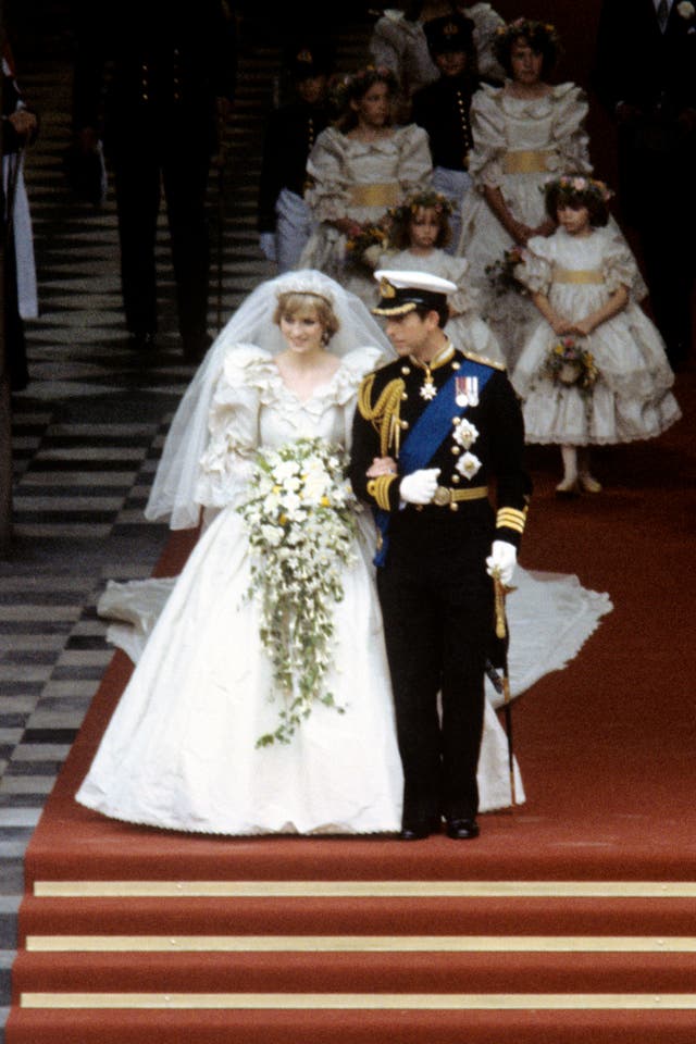 The Prince of Wales and his new wife, The Princess of Wales, walk down the steps of St. Paul's Cathedral, City of London after their marriage