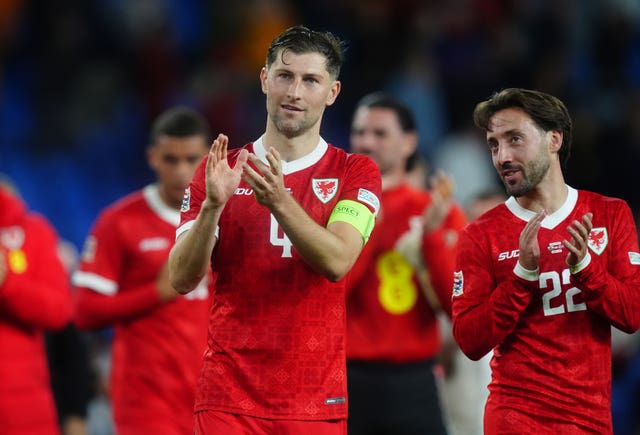 Ben Davies and Josh Sheehan applaud the fans after the game