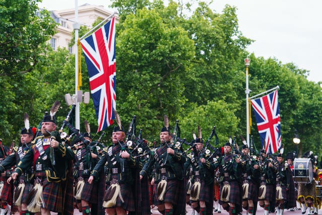 Troops march on The Mall, during an early morning rehearsal as service personnel from the Royal Navy, British Army, and Royal Air Force conduct a final early morning rehearsal through London ahead of Sunday’s Platinum Jubilee Pageant, which will mark the finale of the Platinum Jubilee Weekend