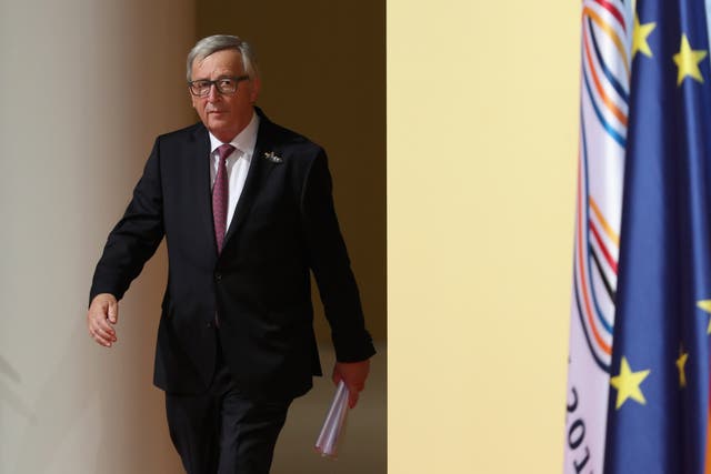 Jean-Claude Juncker has praised Theresa May for being a tough negotiator (Matt Cardy/PA)