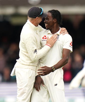 Joe Root and Jofra Archer celebrate the wicket of Australia’s Usman Khawaja