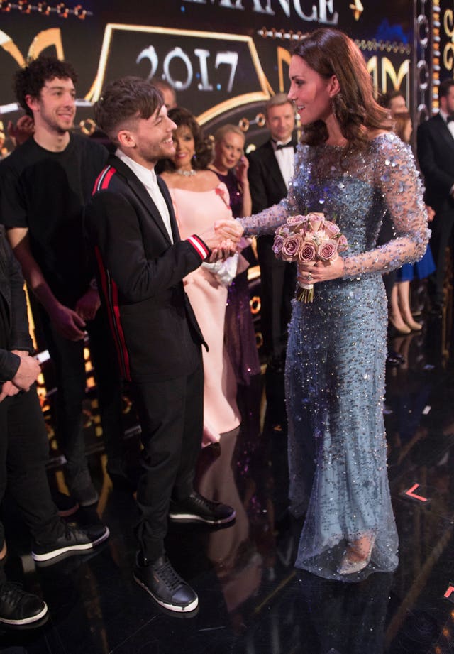 The Duchess of Cambridge meets Louis Tomlinson on stage at the Royal Variety Performance at the London Palladium in central London (Eddie Mulholland/Daily Telegraph/PA)