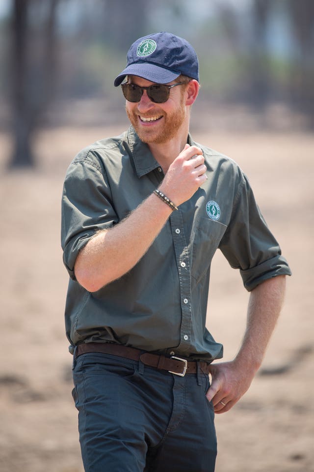 The Duke of Sussex watches an anti-poaching demonstration exercise conducted jointly by local rangers and UK military, at Liwonde National Park, Malawi