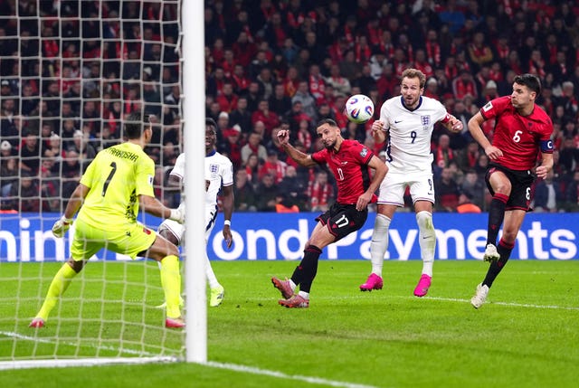 Harry Kane heads home