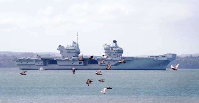 Aircraft carrier HMS Prince of Wales sits off the coast of Gosport, Hampshire, in 2022