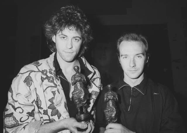 Midge Ure and Bob Geldof at the Ivor Novello Awards for 1984 where they won a joint award for Do They Know It’s Christmas? (PA)