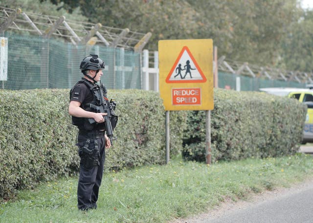 Police at a road block on the road to RAF Fairford after five people were arrested