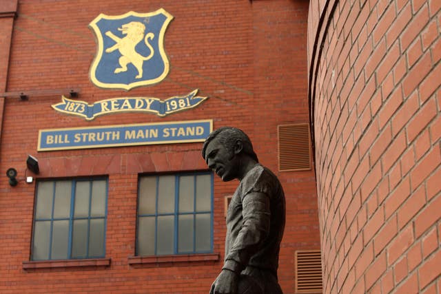 A statue of former Gers skipper John Greig commemorates those who lost their lives