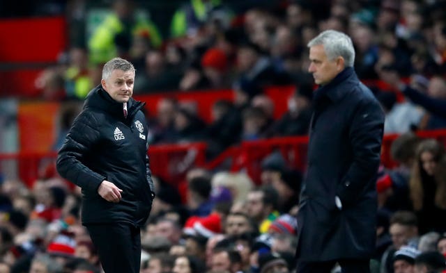 Ole Gunnar Solskjaer looks towards Spurs manager Jose Mourinho 