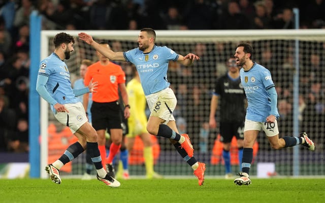 Manchester Cityâs Mateo Kovacic (centre) celebrates scoring their sideâs first goal against Club Brugge