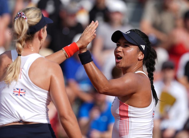 Katie Boulter, left, and Heather Watson high five