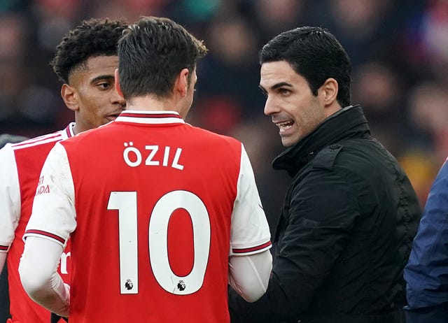 Mikel Arteta (right) appears to have got the best out of Mesut Ozil
