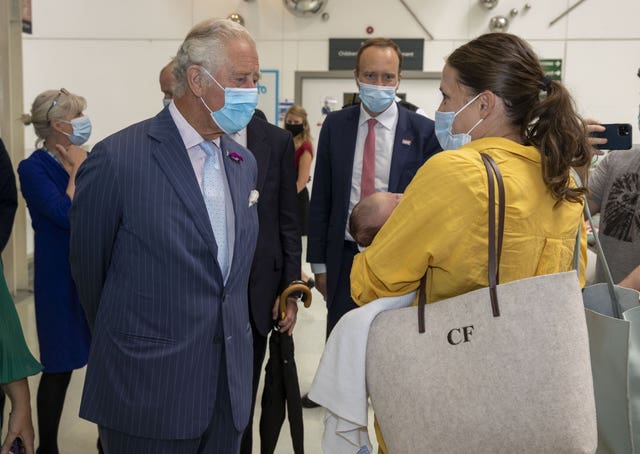 Charles, left, meeting NHS staff during a visit to Chelsea and Westminster Hospital in west London