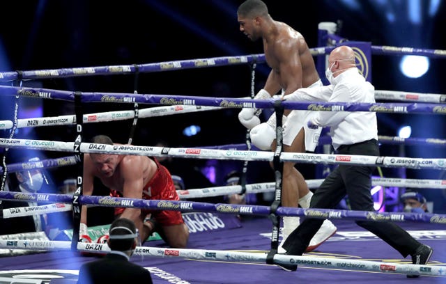 Anthony Joshua knocked down Kubrat Pulev several times before he secured a ninth-round stoppage