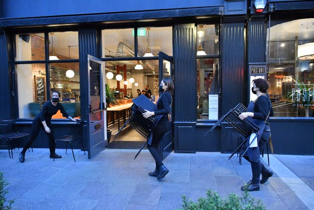Chairs are put away outside a restaurant in Cardiff city centre