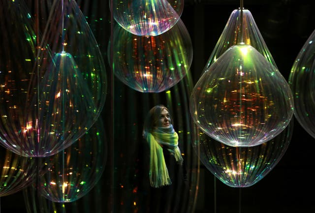 Pippa Dale from London interacts with Reflecting Holons by Michiel Martens & Jetske Visser (Matt Alexander/PA)