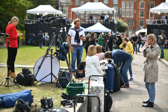 Journalists outside Parliament