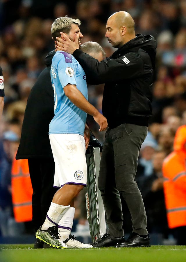 Guardiola (right) still expects to see goals from Aguero this season