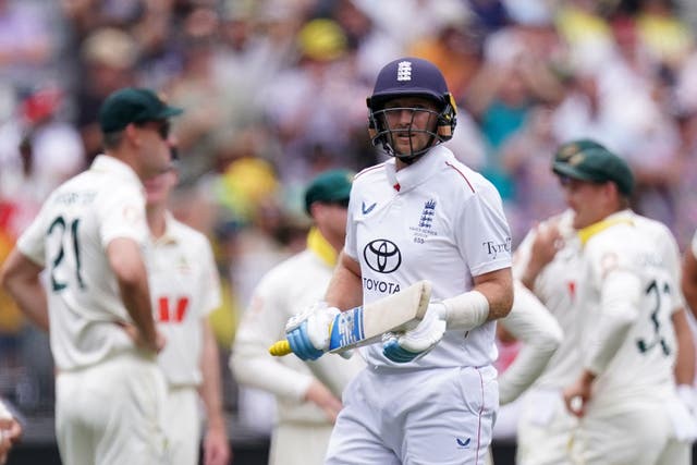 Joe Root (centre) after being dismissed in the first Ashes Test.