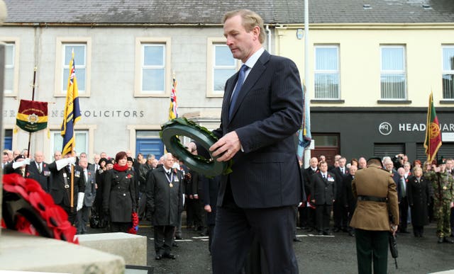 Then-taoiseach Enda Kenny prepares to lay a wreath at the cenotaph in Enniskillen in 2012 during a commemoration ceremony on the 25th anniversary of the IRA Poppy Day bomb attack which claimed the lives of 12 people