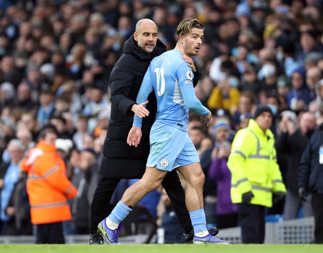 Guardiola (left) is pleased with Grealish's contributions