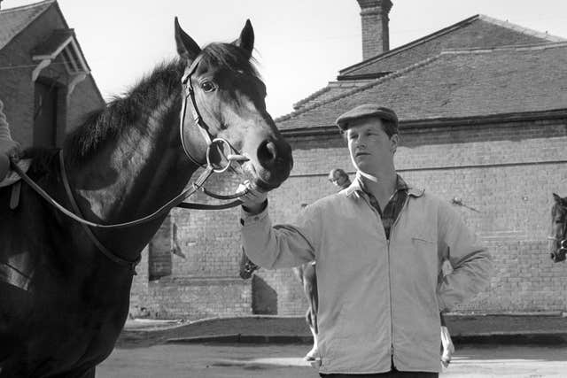 Mill Reef stands with trainer Ian Balding in the build-up to the Derby
