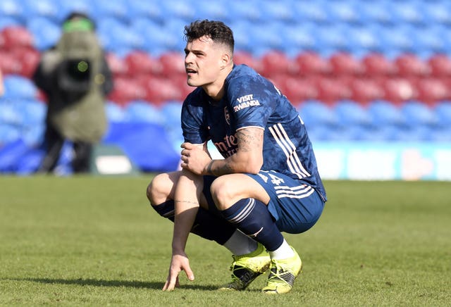 Granit Xhaka looks dejected after his error