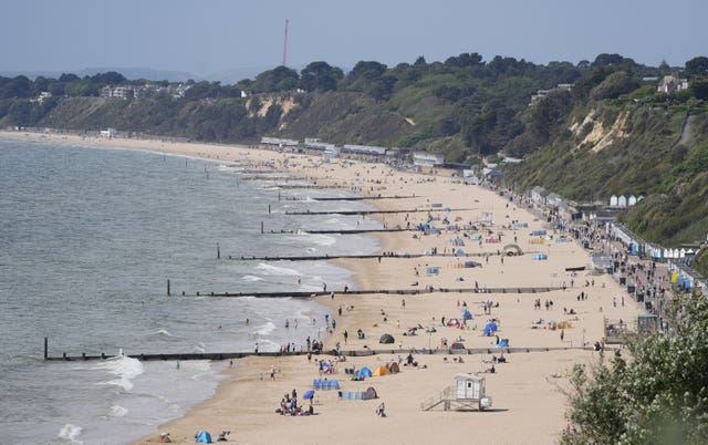 View of a beach busy with sunseekers