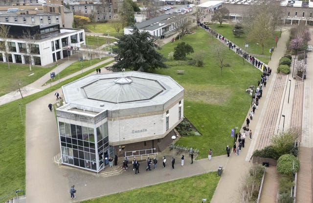 Students queuing for antibiotics outside a building at the University of Kent in Canterbury