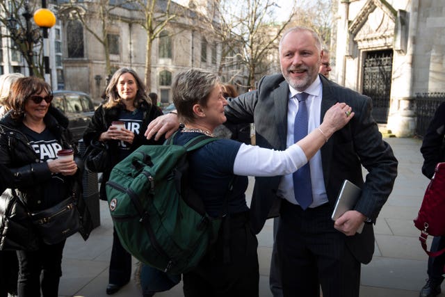 Harry Miller, founder of the campaign group Fair Cop with supporters outside the High Court 