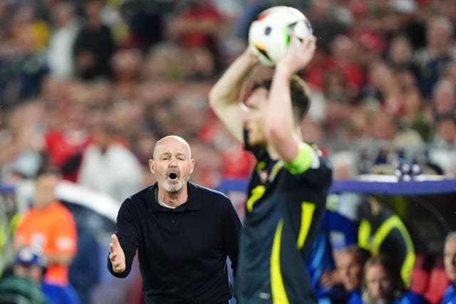 Steve Clarke shouts instructions on the touchline as Andy Robertson takes a throw-in