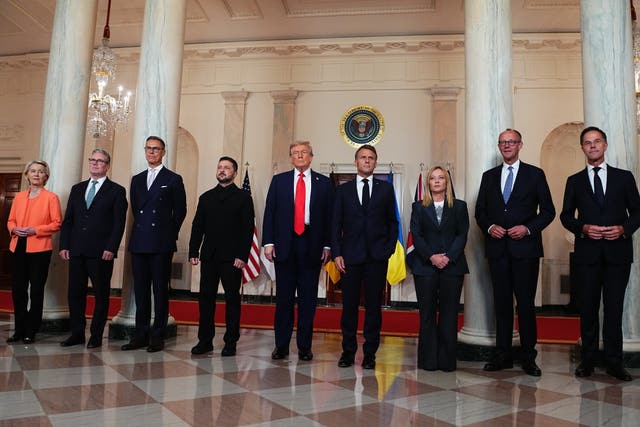 (l to r) Ursula von der Leyen; Sir Keir Starmer; Alexander Stubb; Volodymyr Zelensky; Donald Trump; Emmanuel Macron; Giorgia Meloni; Friedrich Merz and Mark Rutte pose for a ‘family photo’ in the White House