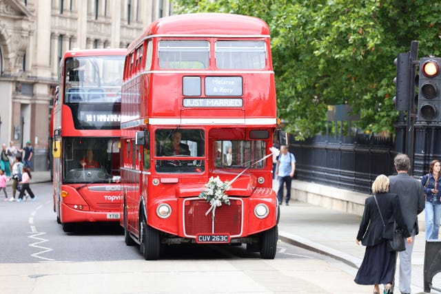A bus arrives to take guests to the reception at The Shard following the wedding of Spice Girl Melanie Brown, Mel B, to fiance hairdresser Rory McPhee at St Paul’s Cathedral, London