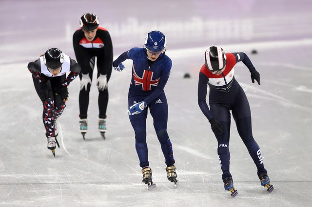 Elise Christie finished second, but was relegated after two indiscretions resulted in a yellow card