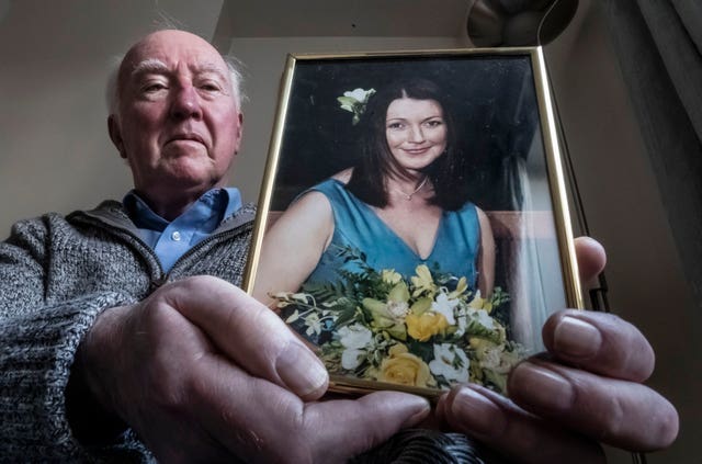 Peter Lawrence with a photograph of his daughter Claudia