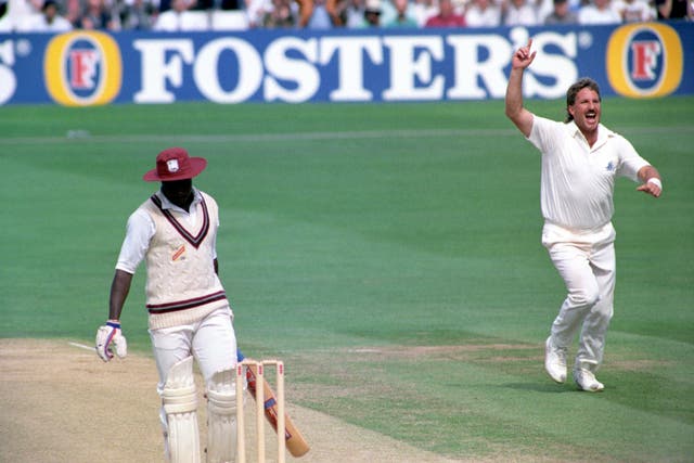 Ian Botham celebrates one of his 383 Test wickets