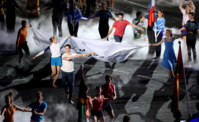 The Commonwealth Games Federation flag is carried at the stadium (Danny Lawson/PA)