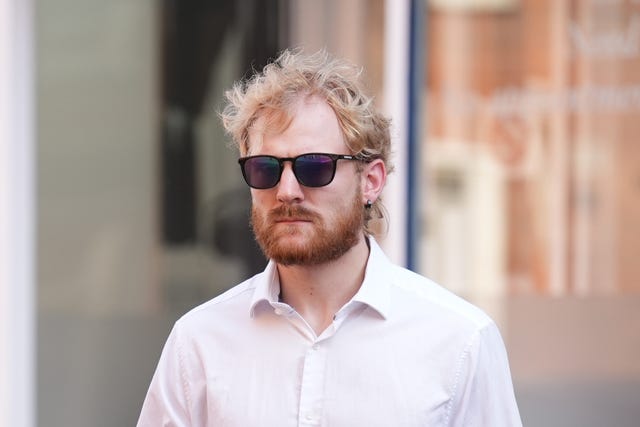 William Heggs wearing white shirt and sunglasses