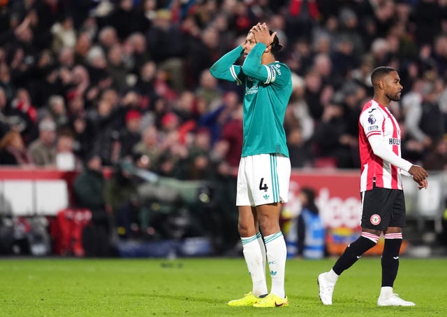 Virgil van Dijk covers his face with his hands
