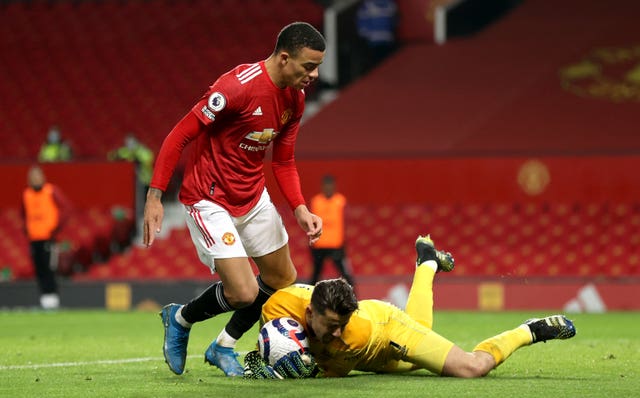 Mason Greenwood, left, is denied by Lukasz Fabianski