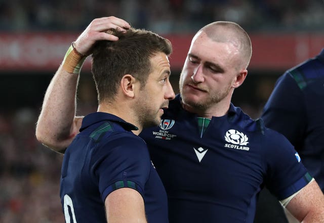 Laidlaw is comforted by team-mate Stuart Hogg