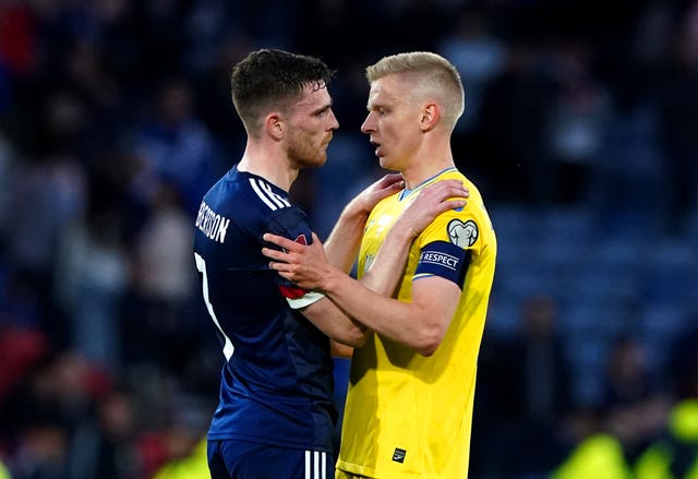 Scotland’s Andrew Robertson (left) speaks to Ukraine’s Oleksandr Zinchenko at the end of the FIFA World Cup 2022 Qualifier play-off semi-final match at Hampden Park in June