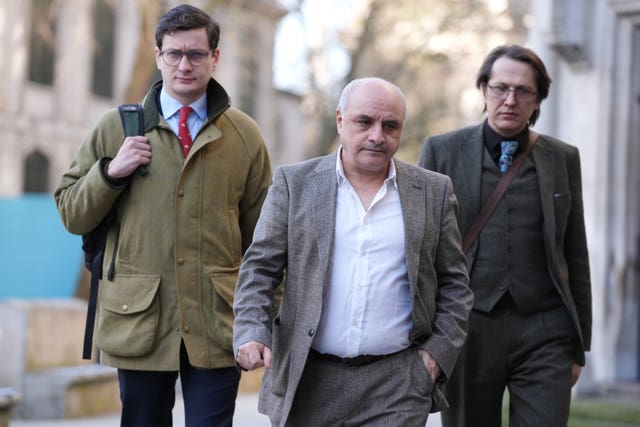 Mr Coskun (centre) has been offered accommodation by the Home Office due to threats made against him following his protest (Ben Whitley/PA)