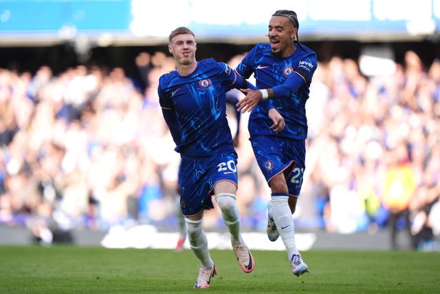 Cole Palmer, left, celebrates his third goal