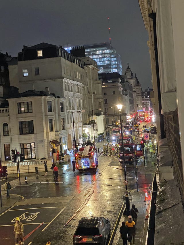 Photo taken with permission from the Twitter feed of @Al_prof of firefighters tackling a blaze at a five-storey hotel near Paddington railway station in central London