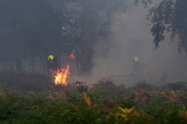 Firefighters tackle a wildfire at Dunwich Heath, near Leiston