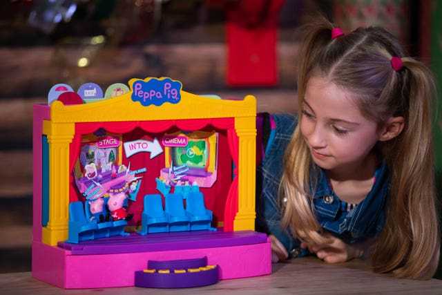 Liana Pierce, seven, plays with a Peppa Pig Peppa’s Stage playset