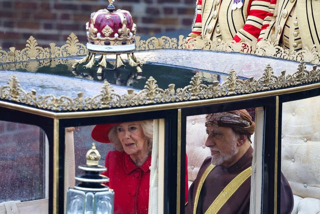 The Queen on her way to Windsor Castle in the Scottish State Coach accompanied by Omani deputy prime minister for defence affairs Sayyid Shihab bin Tariq Al Said