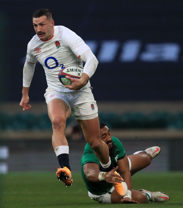 England's Jonny May breaks a tackle before Jonny May scores wonder try against Ireland